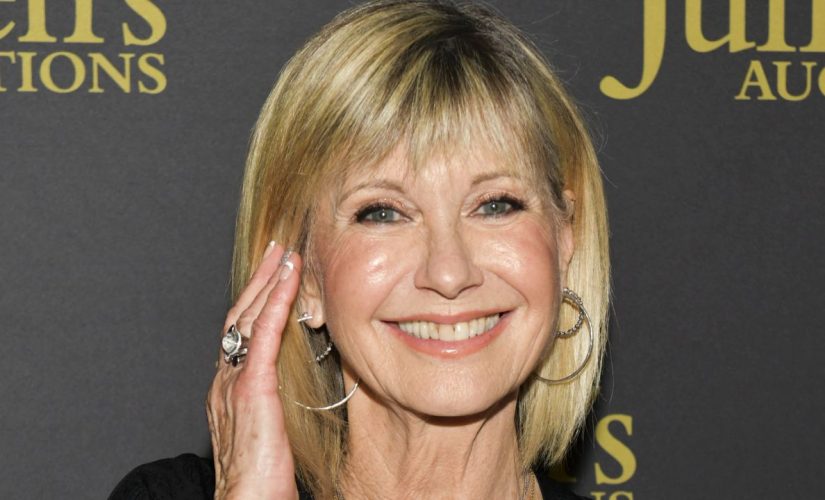 ‘Grease’ star Olivia Newton-John details first kiss with John Travolta: ‘It was a beautiful day’