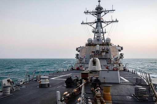 US destroyer sails by disputed islands, shadowed by Chinese warships