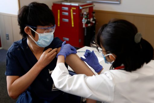 Japan starts COVID-19 vaccinations with eye on Olympics