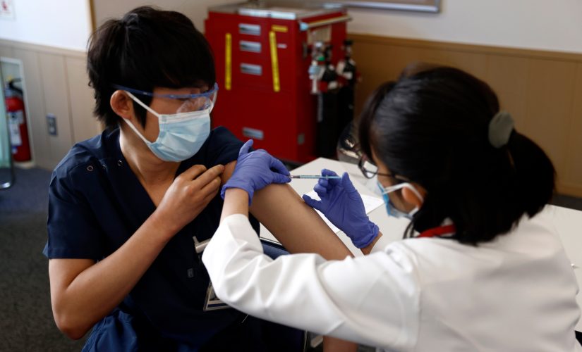 Japan starts COVID-19 vaccinations with eye on Olympics