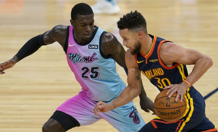 Curry and his supporting cast rally Warriors past Heat in OT