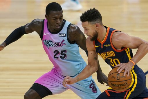 Curry and his supporting cast rally Warriors past Heat in OT