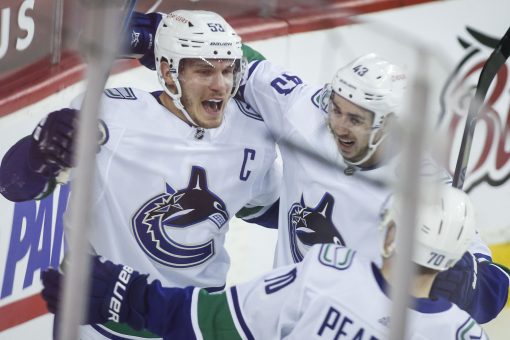 Boeser leads Canucks past Flames in last of 4 straight games