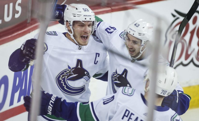 Boeser leads Canucks past Flames in last of 4 straight games