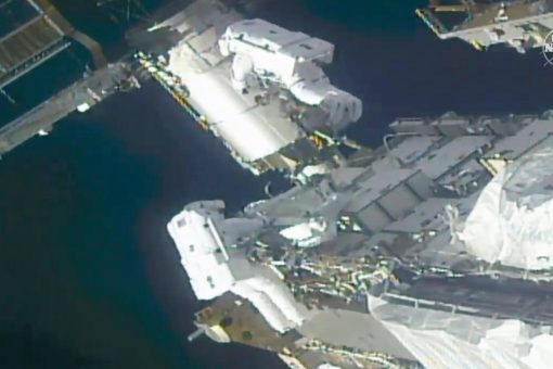 Spacewalking astronauts prep station for new solar wings