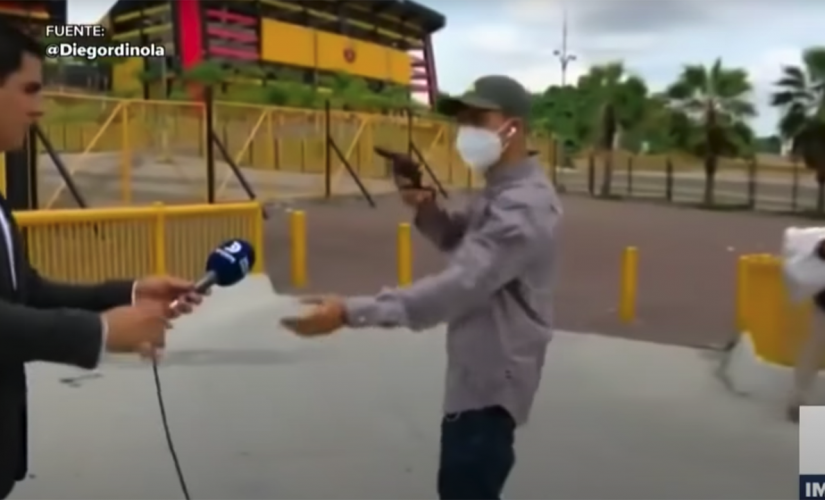 Gun-waving robber holds up TV reporter, crew while filming in Ecuador