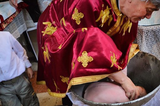 Romanian Orthodox Church faces backlash after baby dies following baptism