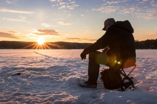 Massachusetts fisherman reels in huge brown trout while ice fishing