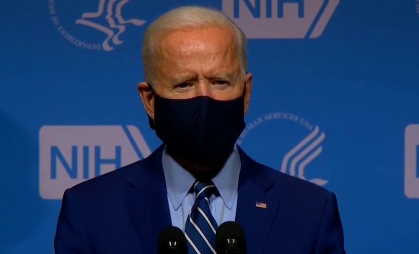 Biden indicates that masks will be worn though next year