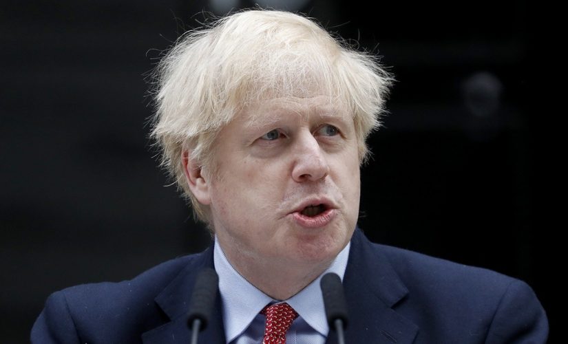 Boris Johnson struggles to put gloves on at vaccine center, makes OJ Simpson crack