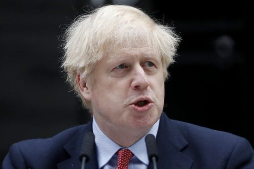 Boris Johnson struggles to put gloves on at vaccine center, makes OJ Simpson crack