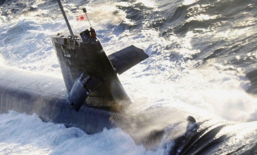 Japan submarine collides with commercial ship while surfacing: report