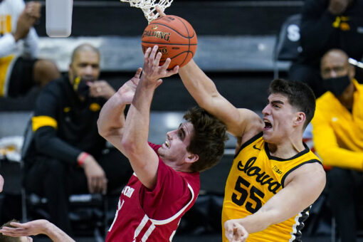 Garza leads No. 5 Iowa past Wisconsin in Big Ten tourney