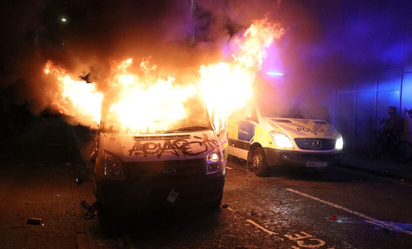 Police officers hurt, vehicles set on fire in violent protest in Bristol, England