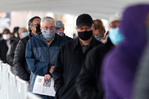 Americans wait for COVID-19 vaccines as US commits millions of doses for Mexico, Canada