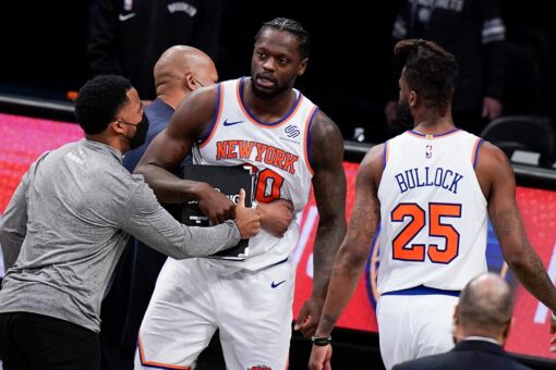 Knicks’ Julius Randle restrained by teammates, taken off the court after controversial call in loss to Nets