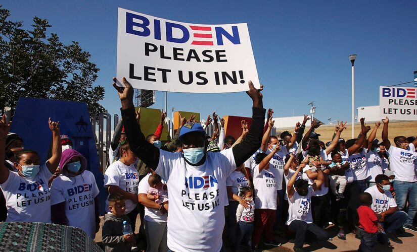 Migrants wear Biden T-shirts at US-Mexico border, demand clearer policies