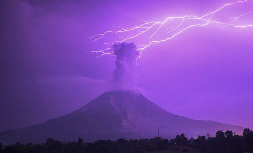 Lightning strikes erupting Indonesia volcano spewing 16,000-foot ash cloud