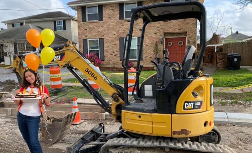 Woman celebrates year of unfinished construction in front of New Orleans home