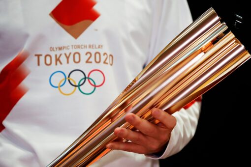 Tokyo Olympic torch relay: Masks, quiet cheering and caution
