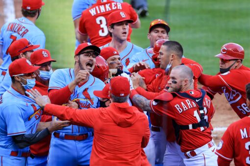 Reds scrap with Cards at plate, tangle in outfield, win 9-6
