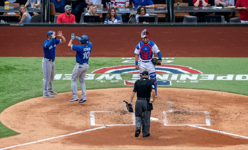 Blue Jays spoil Rangers home opener before largest MLB crowd