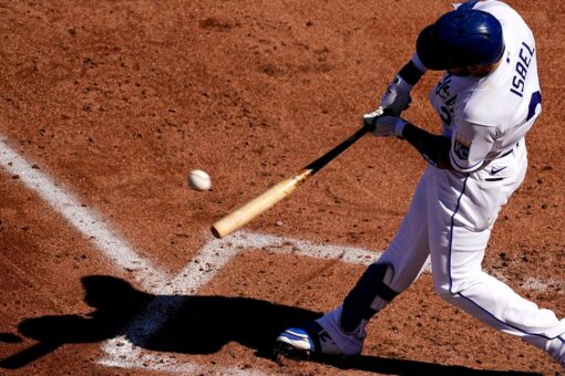 Royals outslug Rangers 14-10 in wild season opener