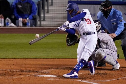 Betts, Bauer star for new fans as Dodgers crush Rockies 7-0