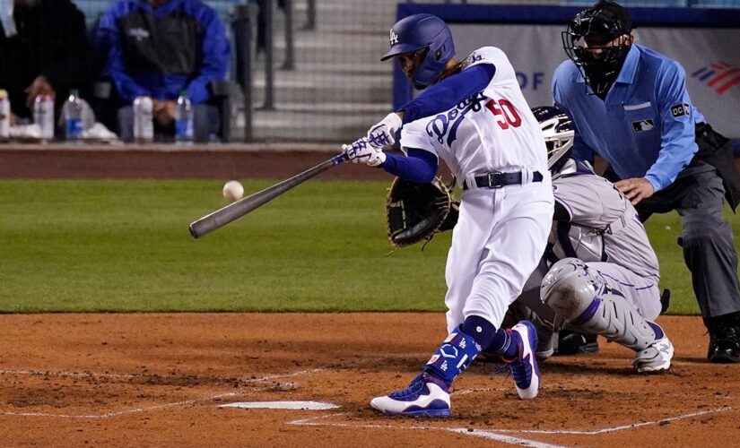 Betts, Bauer star for new fans as Dodgers crush Rockies 7-0