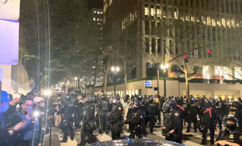 Riot declared in Portland after protesters cause damage following police shootings