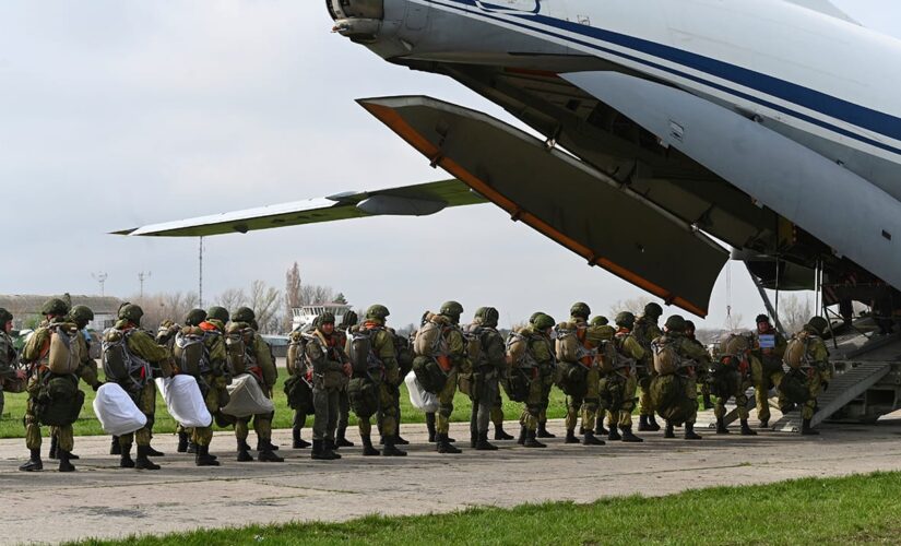 Russia orders troop pullback, but keeps weapons near Ukraine