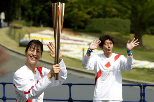 Olympic torch runs through empty park in Osaka as cases rise