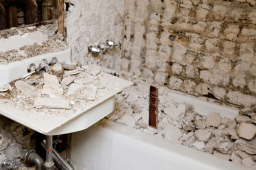 Homeowners find damaged shower walled up behind bathroom wall