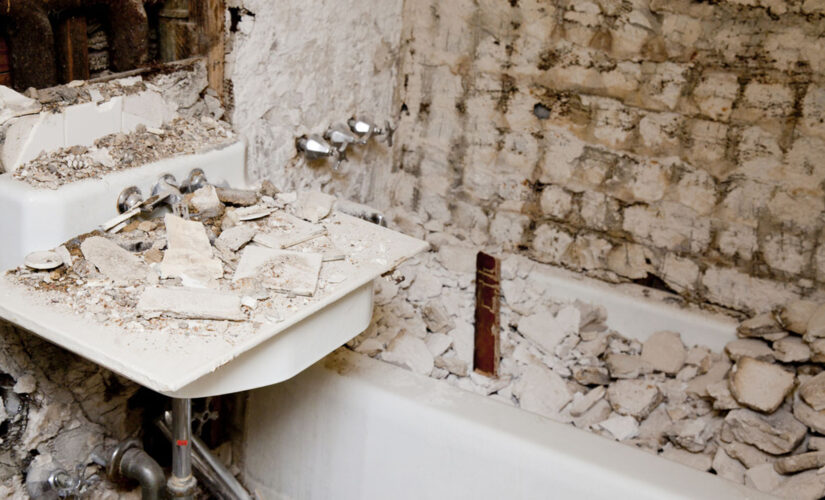 Homeowners find damaged shower walled up behind bathroom wall