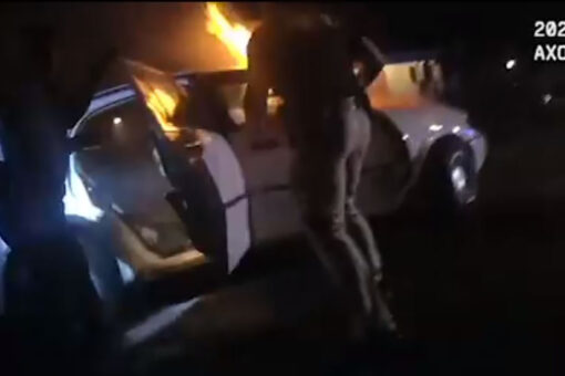 Georgia police save unconscious woman trapped in burning car, video shows