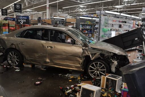 Ex-Walmart employee slams car through store