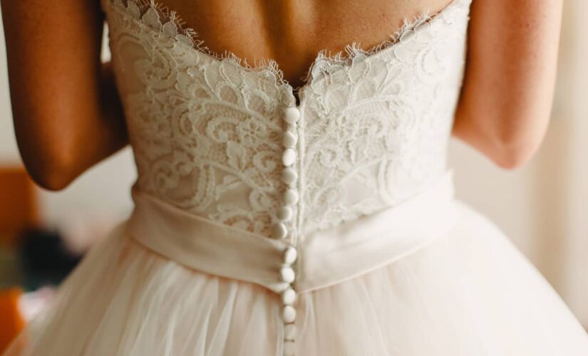 Baltimore bride wears wedding reception dress to get COVID-19 vaccine