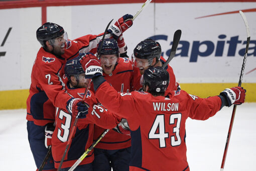 Capitals beat Flyers in overtime, Penguins win East Division