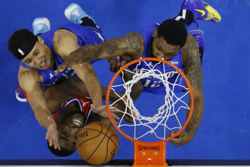 Curry, Embiid help 76ers top Magic, clinch top seed in East