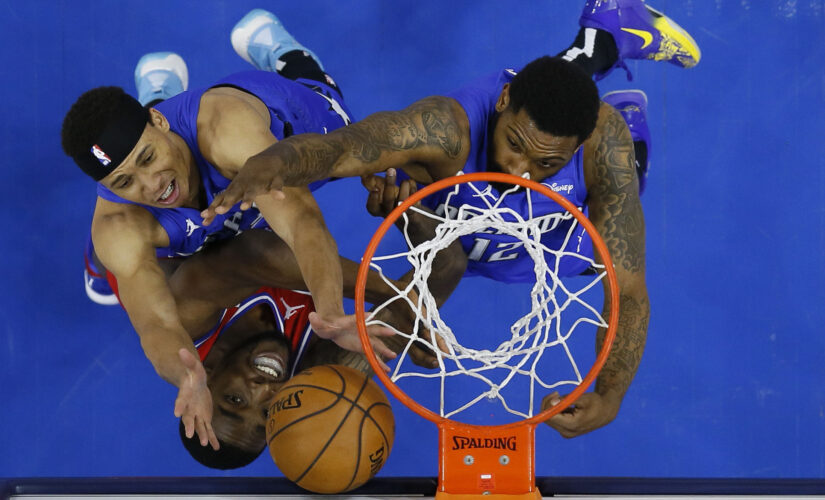 Curry, Embiid help 76ers top Magic, clinch top seed in East