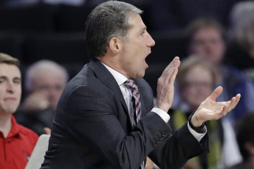 Former Louisville assistant charged by feds with extortion