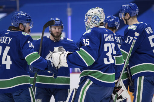 Demko makes 38 saves and Canucks top Flames 4-2