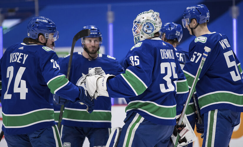 Demko makes 38 saves and Canucks top Flames 4-2