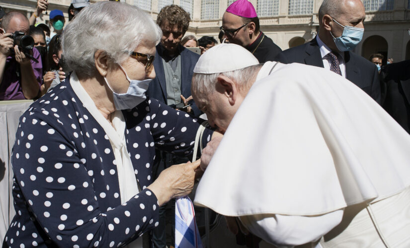 Pope kisses hand of Auschwitz survivor