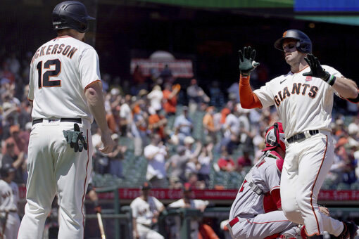 Giants hit 3 more homers to back Cueto, beat Angels 6-1