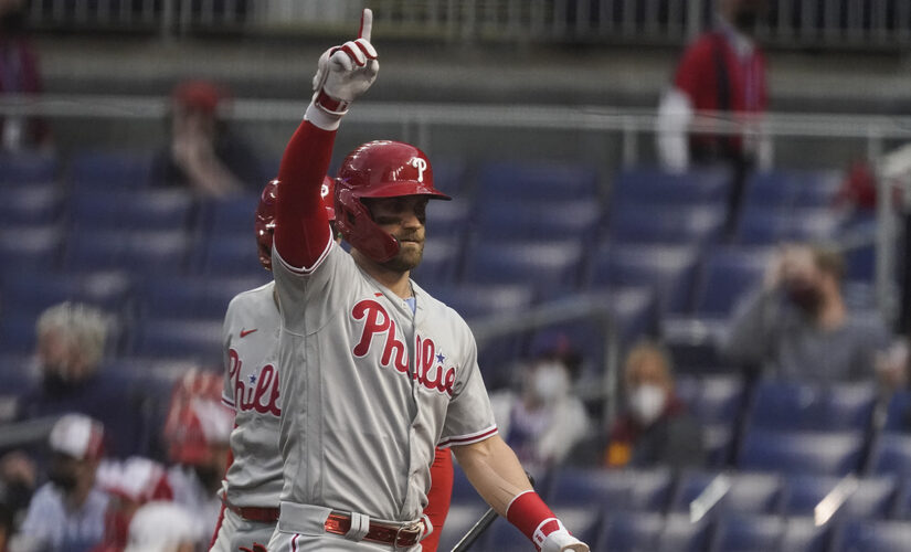 Heckled Harper homers, Realmuto exits early, Phils top Nats