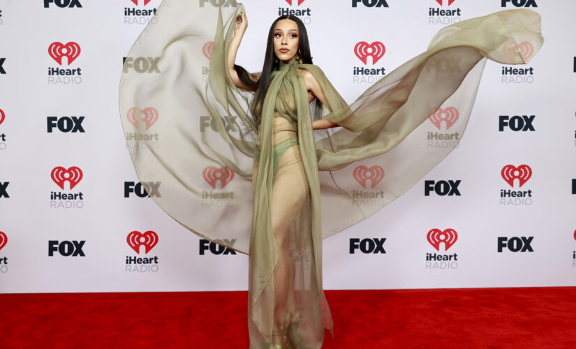 Doja Cat rocks see-through dress on 2021 iHeartRadio Music Awards red carpet