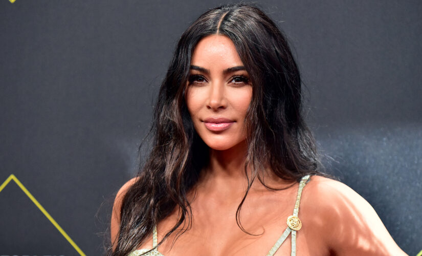 Kim Kardashian shows off figure, platinum blonde hair while working out in revealing swimsuit