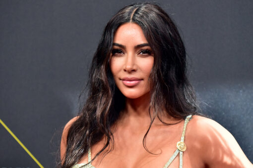 Kim Kardashian shows off figure, platinum blonde hair while working out in revealing swimsuit