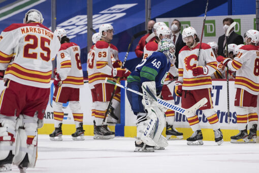 Lindholm’s OT goal lifts Flames past Canucks 6-5